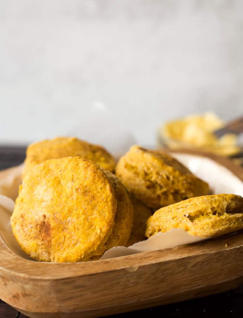 A bowl of freshly baked pumpkin biscuits made with Bisquick.