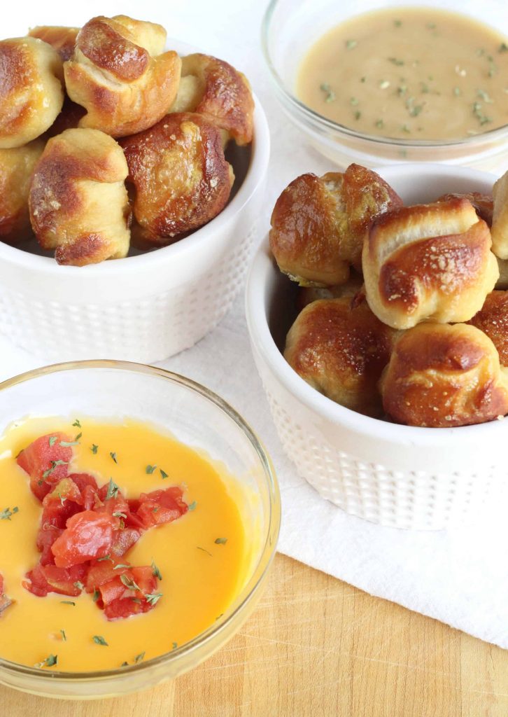 pizza dough pretzel bites with queso and honey mustard dipping sauces