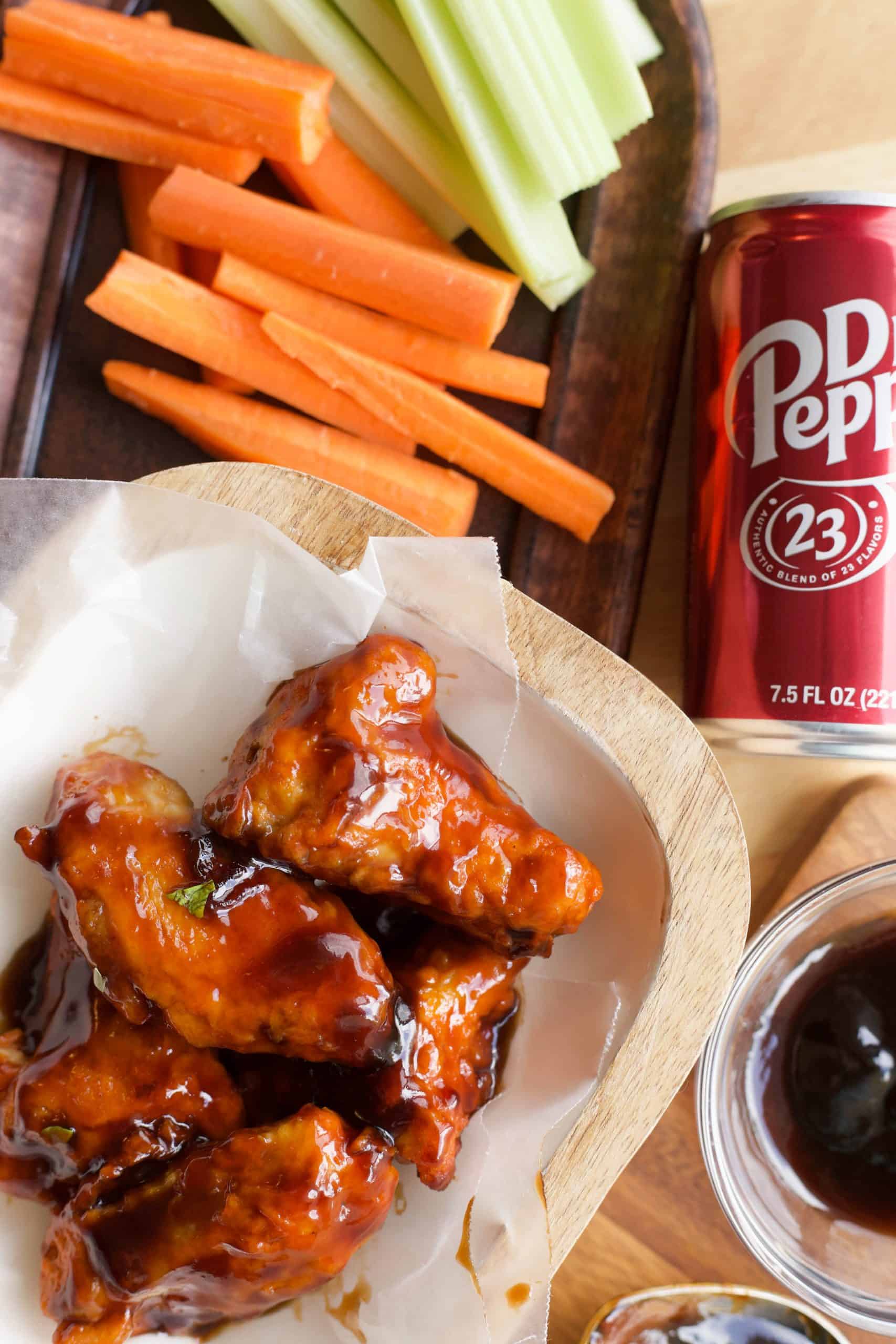 Dr Pepper Hot Wings in bowl next to a can of dr pepper