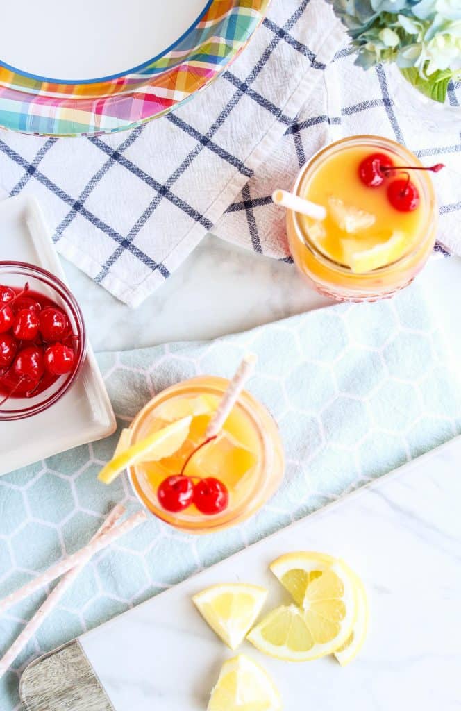 Easy 3-Ingredient Orangeade party drink with paper party supplies