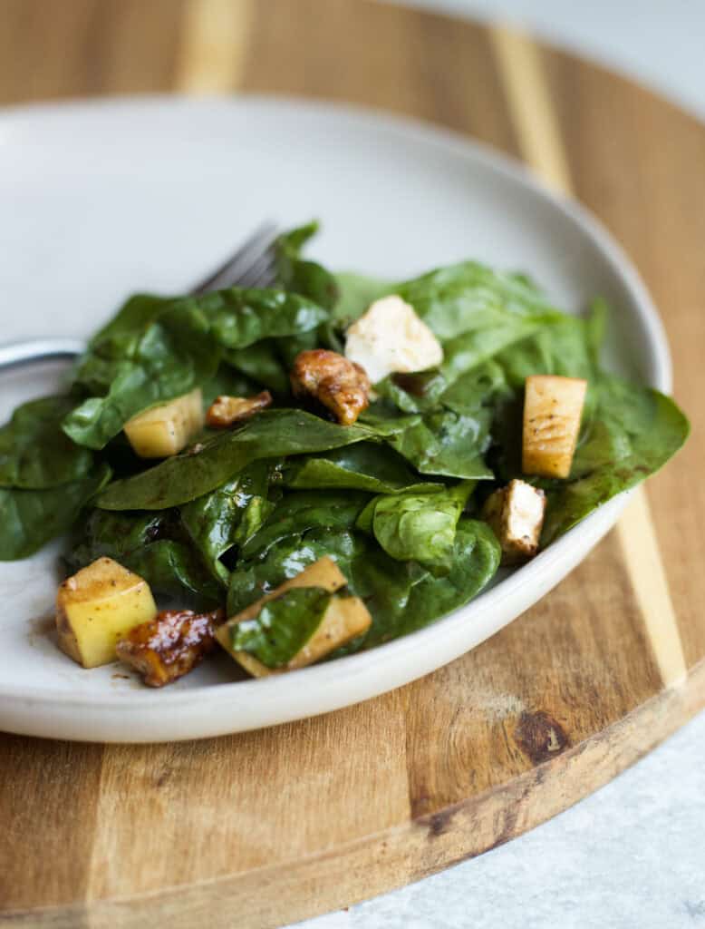 A serving of Apple Brie Pecan Salad on a plate.