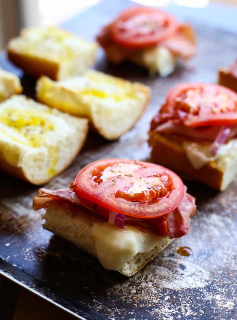 italian sub sandwich topped with tomato