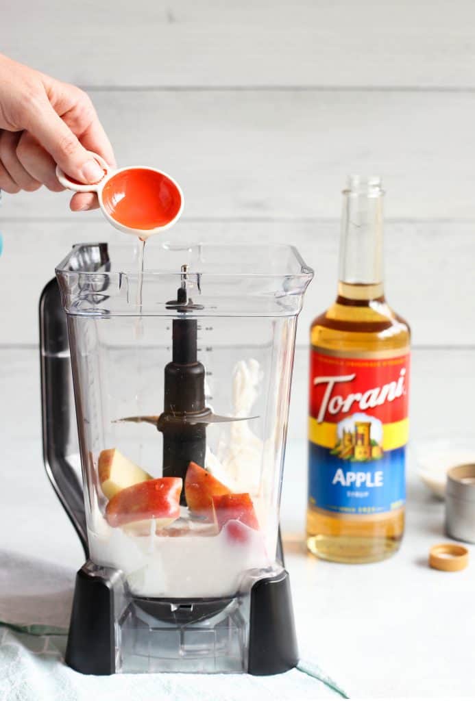 adding Torani apple syrup to blender