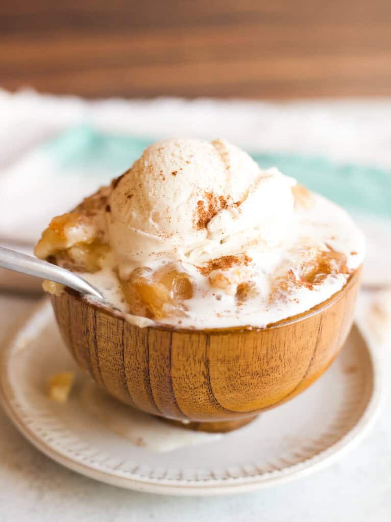 apple cake cobbler topped with vanilla ice cream