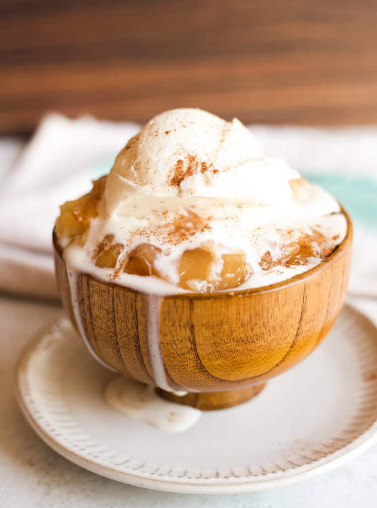 A bowl of crockpot apple cake cobbler.