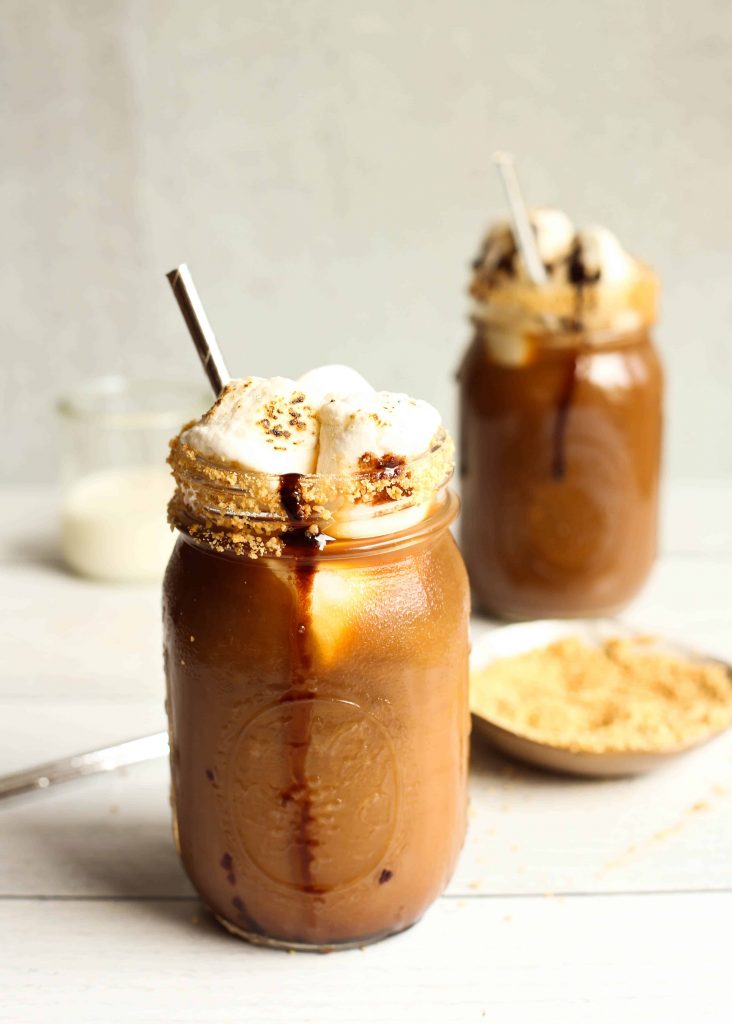 Two glasses of iced coffee with s'mores flavored syrup.