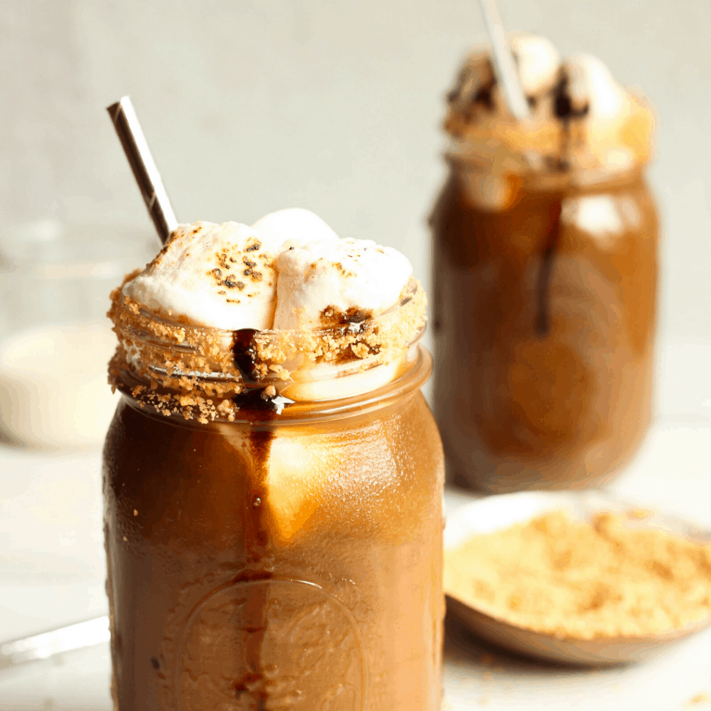 Glass of S'mores Cold Brew topped with toasted marshmallows.