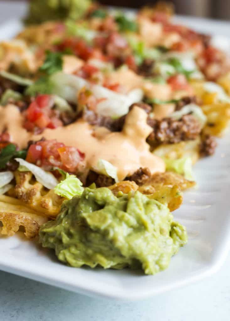 waffles fries topped with taco ingredients