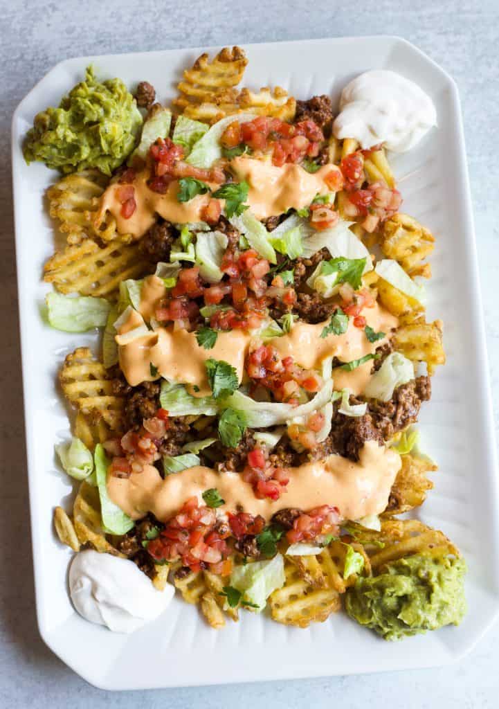 loaded taco fries on a platter