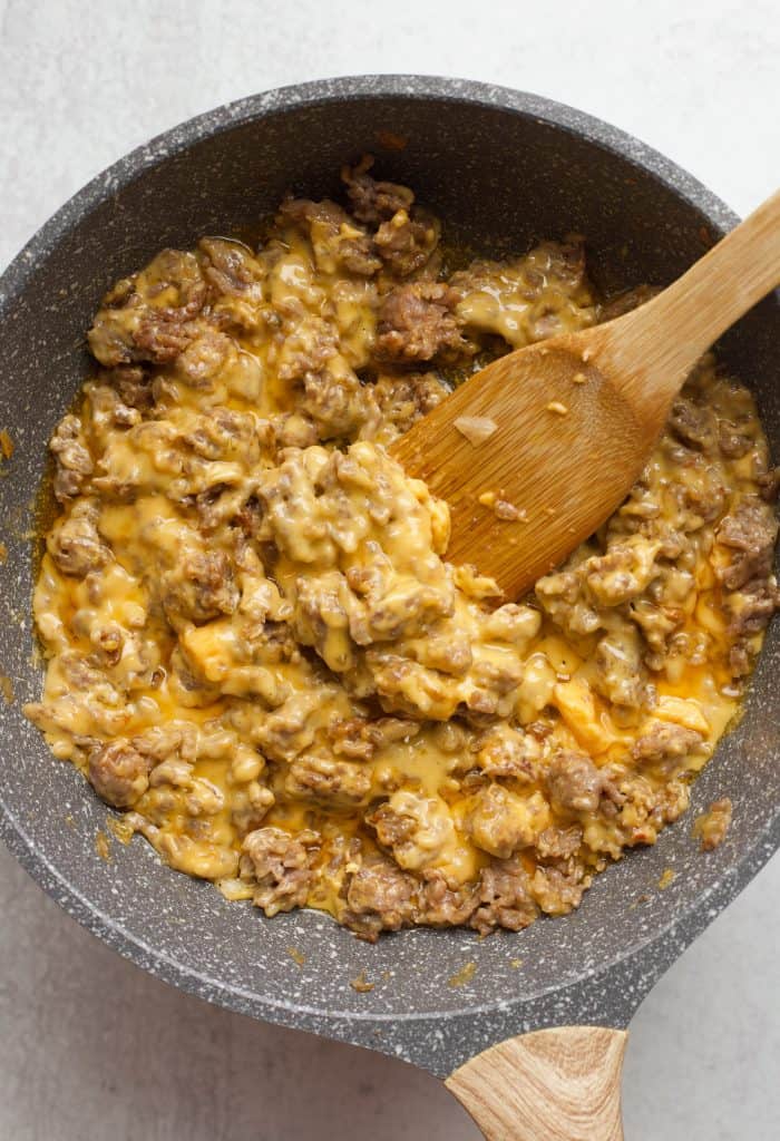 cooked sausage and velveeta cheese in skillet