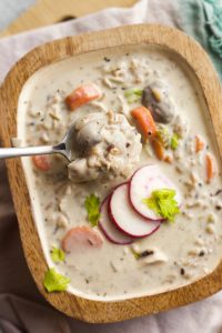soup scooping up a bite of rotisserie chicken in Chicken Mushroom And Wild Rice Soup