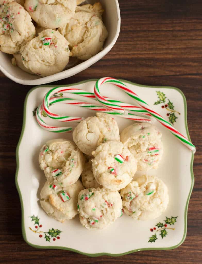 Plate of Cake Mix Peppermint Cookies next to a bowl of cookies.