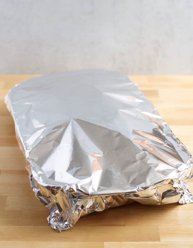 Casserole dish covered with aluminum foil.